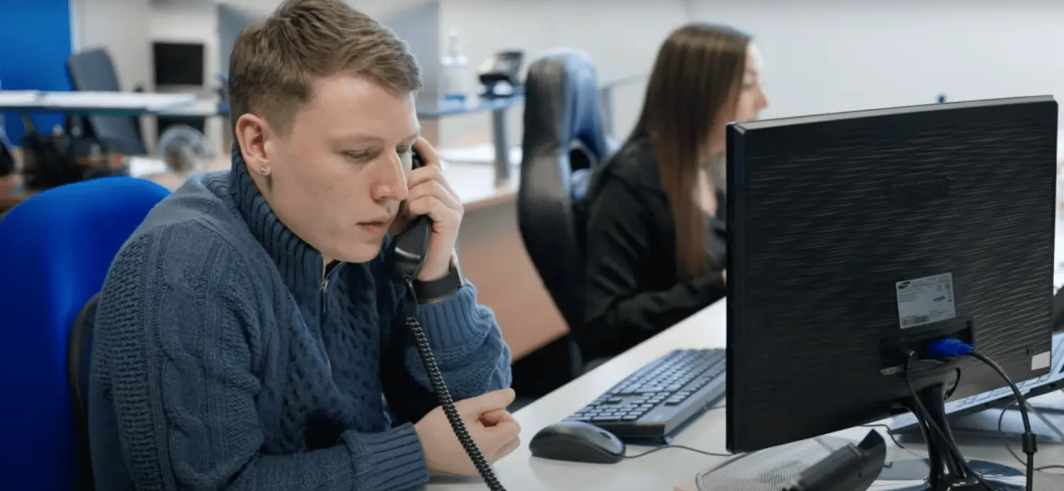 Joe in office taking call